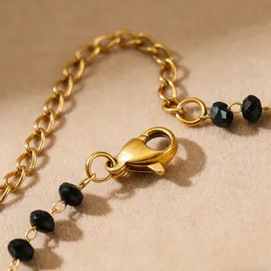 Bohemian gold plated stainless steel beaded necklace set with black multifaceted beads