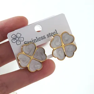 Elegant four-leaf clover stud earrings in gold stainless steel with marble enamel texture
