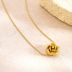 Detailed close-up of a 3D gold-plated rose pendant necklace with layered metal petals