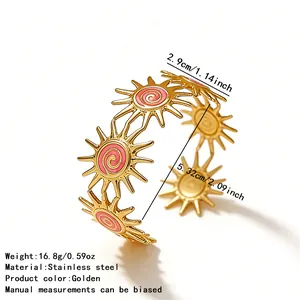 Macro detail of golden stainless steel sun bracelet with pink enamel and size dimensions