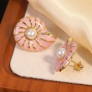 Pink enamel conch earrings with pearls and gold stainless steel finish for women