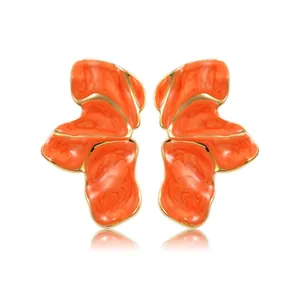 Artistic orange petal earrings with gold trim and marble enamel on white background