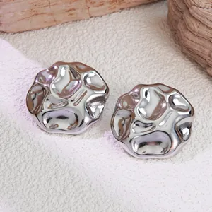 Minimalist silver titanium steel flower earrings with irregular lava texture design