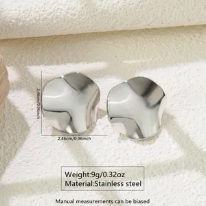 Detail view of irregular wave-textured silver stainless steel earrings with size specs
