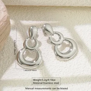 Detail showing dimensions of abstract triple loop stainless steel earrings in silver