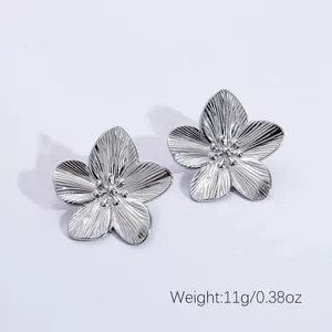 Detailed close-up of silver steel flower earrings showing weight 11g and petal texture