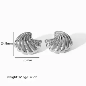 Detailed view of silver scallop shell earrings with dimensions 30mm width and 24.8mm height