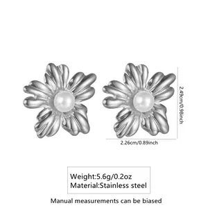Detail view of silver floral earrings with pearl center and stainless steel dimensions