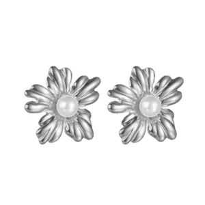 Elegant titanium steel flower stud earrings with pearl center on white background