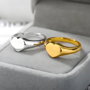 Gold and silver heart signet rings in stainless steel with polished mirror finish