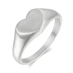 Minimalist silver stainless steel heart signet ring with a brushed texture finish