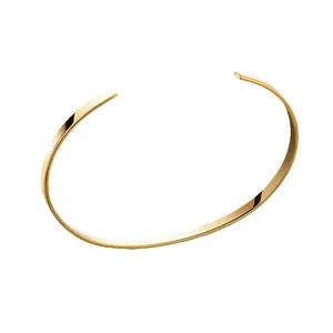 Minimalist open gold cuff bracelet with a polished flat surface and sleek metal finish