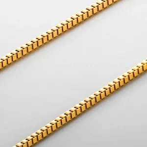 Elegant gold box chain necklace made of stainless steel shown from a high-angle view