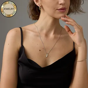 Three-piece stainless steel jewelry set with bar pendant, earrings, and gold tennis bracelet
