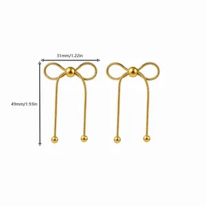Detailed view of gold bow knot tassel earrings with measurement specs 31mm by 49mm