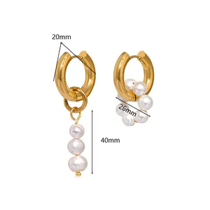 Detailed size view of asymmetric gold titanium hoop earrings with baroque pearls
