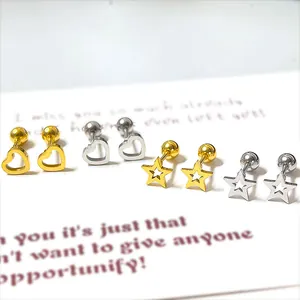 Detailed view of hollow heart and star stud earrings set in gold and silver finishes