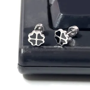 Macro shot of silver titanium clover earrings with black enamel and screw back detail