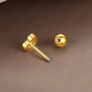 Golden heart-shaped stud earrings with secure screw-back ball closures for women