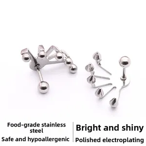 Detalle de los pendientes de bola y punta de acero inoxidable pulido de grado alimenticio
