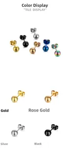 Détail de boucles d'oreilles boules en acier titane en or, or rose, argent et noir