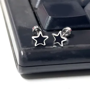 Macro shot of silver star stud earrings with black enamel and secure screw-back closure
