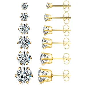 Détail de six tailles de boucles d'oreilles en acier doré avec griffes et oxydes de zirconium