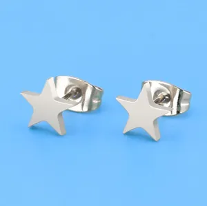 Macro detail of silver stainless steel star stud earrings with butterfly backings