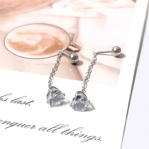 Detailed view of silver heart pendant earrings with chain and spherical screw back design