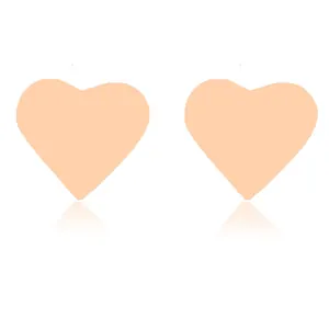 Detailed view of pale pink heart-shaped stainless steel earrings on a plain white background