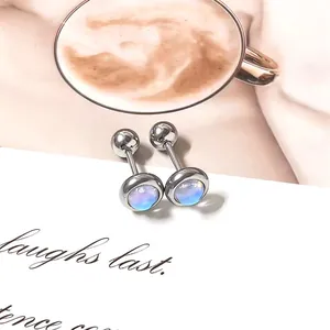Detailed view of silver screw-back stud earrings with blue iridescent moonstones