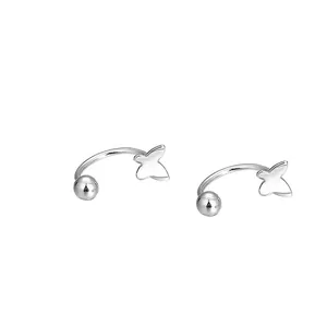 Minimalist silver butterfly tassel ear cuff earrings with polished finish on white background
