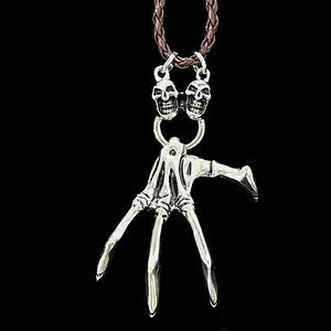 Gothic skull hand pendant necklace with dark skeleton palm and brown braided cord