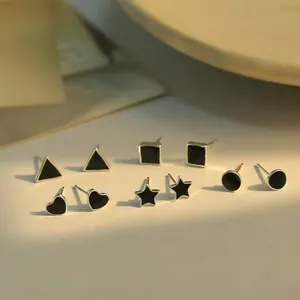 5-piece set of black geometric drip oil stud earrings in minimalist silver heart shapes