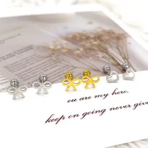 Minimalist heart and bow stainless steel barbell stud earrings set on white background