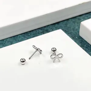 Pair of silver minimalist stainless steel bow knot stud earrings with screw ball backs