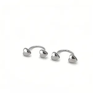 Detailed view of polished silver heart-shaped U-shaped barbell earrings for women