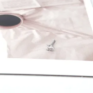 Silver scorpion nose stud in a minimalist straight bar design for unique nose piercings