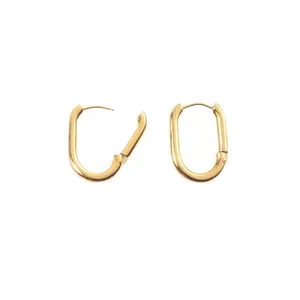 Minimalist oval gold stainless steel hoop earrings with hinge mechanism on white background
