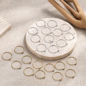 Minimalist stackable birthstone rings in gold and silver finish with colorful zircons