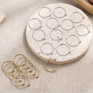 Detailed view of 22-piece birthstone rings set in gold and silver stainless steel finish