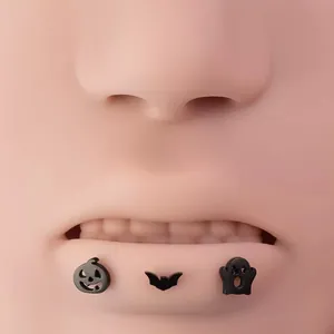 Matte black titanium steel Halloween lip stud set with pumpkin, bat, and ghost designs