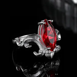 Luxury marquise-cut red gemstone ring with vintage silver crown setting and micro-pave