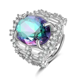 Macro van luxe ovale regenboog saffier ring met gelaagde zirkonia pavézetting