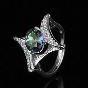 Adjustable silver ring with round rainbow gemstone in a sparkling four-pointed star setting