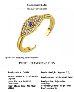 Macro shot of gold-plated copper eye ring with blue zircon inlay and adjustable band