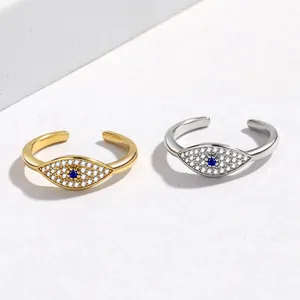 Adjustable evil eye ring in gold and silver finish with blue stone and micro pavé