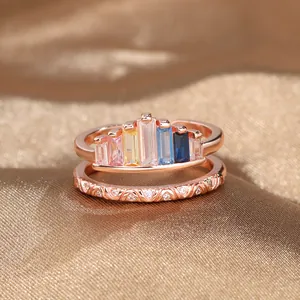 Rainbow crown ring with baguette-cut zircons and rose gold double layer band