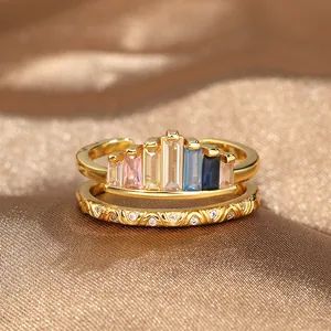 Detailed close-up of adjustable golden crown ring set with multicolored zircon stones