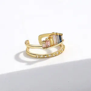 Detail of gold-plated double-layer ring featuring rainbow gradient zircons and micro-pave stones